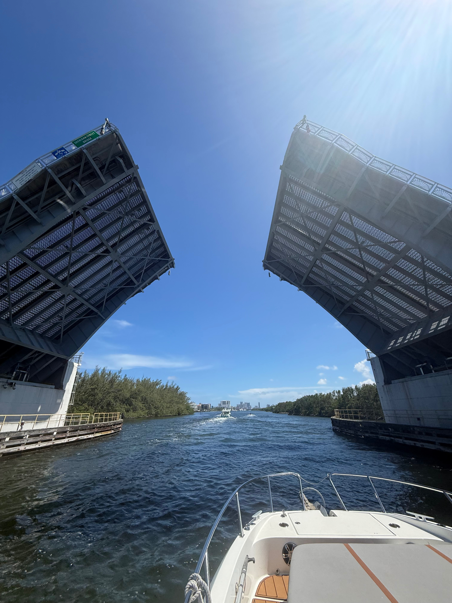 Sheridan Street drawbridge opening overhead as seen from the bow of a charter boat on the Intracoastal Waterway