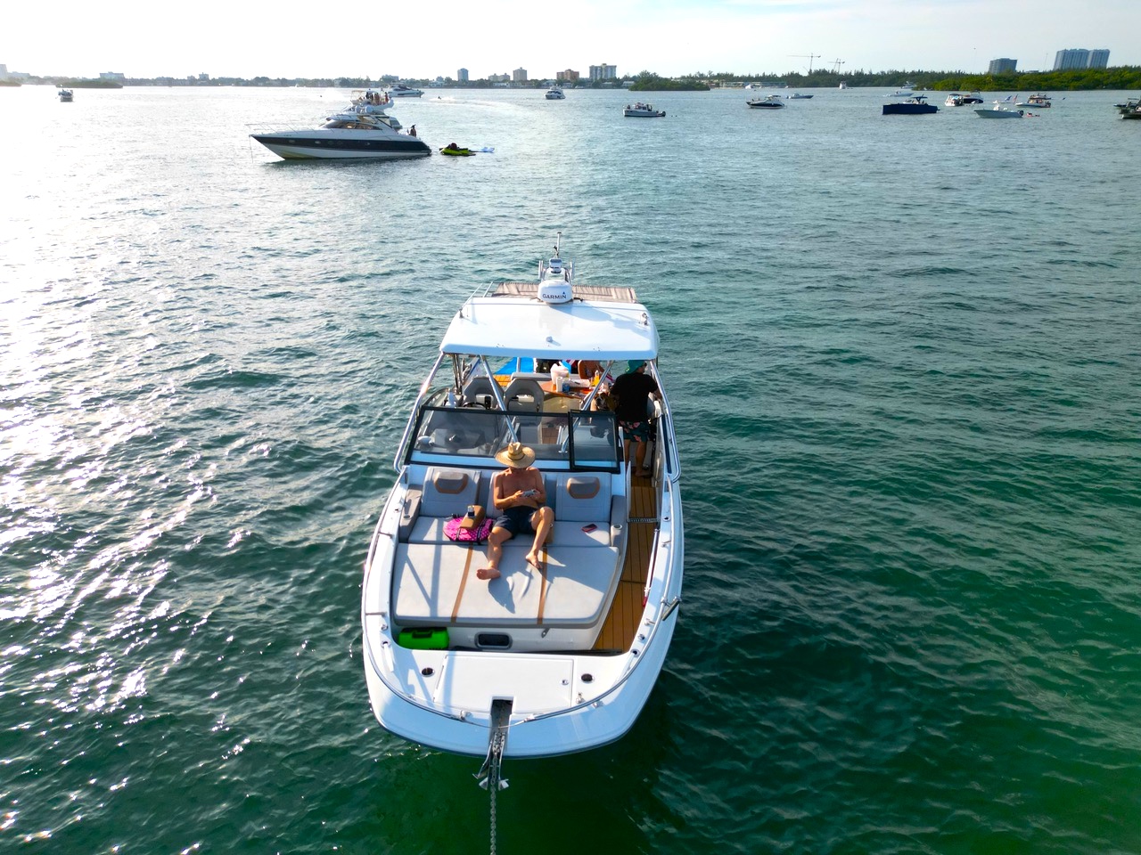 Aerial view of Beneteau Flyer 32 private charter yacht in Fort Lauderdale with guests lounging on the bow