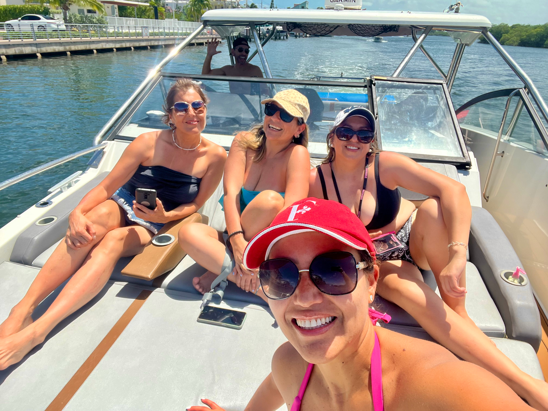 Friends taking a selfie on the sunpad while cruising the Fort Lauderdale Intracoastal Waterway